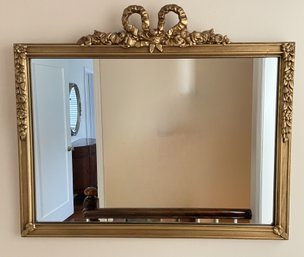 VINTAGE GOLD GILT MIRROR WITH ORNATE BOW AND FLORAL VINE DETAIL