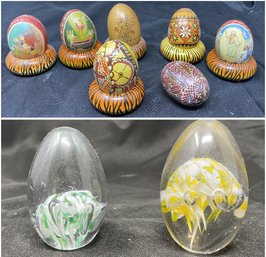 COLLECTION OF 7 HAND PAINTED EGG FIGURINES AND 2 CLEAR GLASS PAPER WEIGHTS