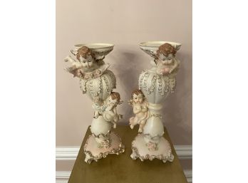 Pair Of Ceramic Playful Cherubs Candle Holders