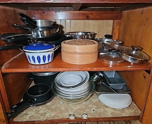 R7 Lot To Include Two Shelves Full Of Pots And Pans, Glass Lids, Steam Tray, Glass Bowls And More