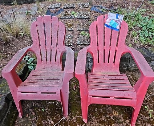 R00 Two Red Plastic Lawn Chairs