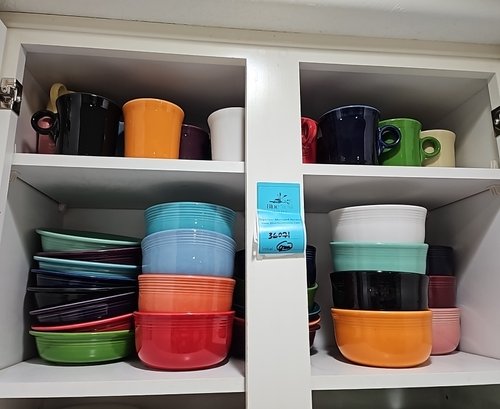 R10 Two Shelves Full Of Fiesta Ware Including Variety Of Bowls And Mugs