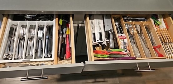 R5 Two Drawers Full Of Knives, Silverware, And Other Kitchen Utensils