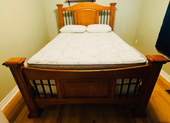 R6 Wood Queen Bed With Sertapedic Mattress And A Boxspring And Two Pillows
