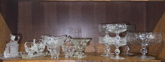 Champagne Glasses And Other Serving Ware, Which Appears To Be Mostly Crystal