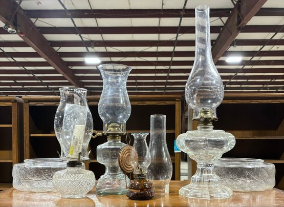 Hurricane Oil Lamp Collection Of Four To Include Glass Covers Which Were To Be Used For Light Fixtures