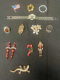 Jewelry Lot 2 To Include Eight Broaches, Two Rings, And A Watch