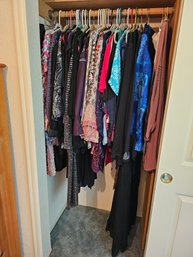 R9 Entire Left Side Of Closet Full Of Women's Blouses, Dresses, And Other Women's Clothing