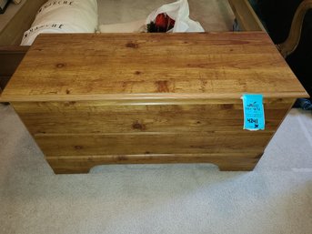 Wooden Chest And Women's Sweaters