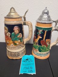 2 Beer Steins About 8in Tall. One Has A Music Box On The Bottom And The Other Has Marking That Says Made In Ge