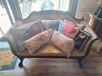 Victorian Style Sofa, Decorative Pillows And Vase With Fake Flowers.
