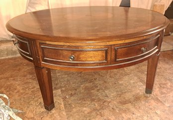 Wooden Coffee Table With Four Drawers On Wheels.