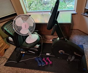 Exercise Bike, Electrical Fan, Dumbells And Floor Mat.