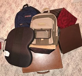 Two Book Bags, Binders, Desk Chair Cushion, Cabinet Shelf.