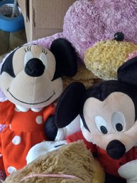 Collection Of Stuffed Animals Including Mickey And Minnie Mouse, A Moose, Bears, A Bunny, And An Emoji Pillow