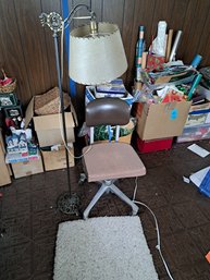 Swivel Chair, Standing Lamp And Small Rug