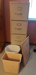 File Cabinet, Two Trash Cans And Cork Board.