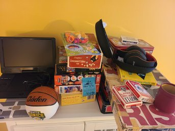 Games And Puzzles, Phone Case, Headphones With Case, Blackwell Blu-ray Player And Small Sonics Basketball