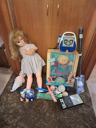 Rm.3. Vintage Kids Toys Including Cabbage Patch Kid Doll, Gumball Machine, Bat And Ball, Cassette Recorder