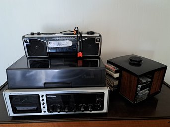 Rm. 6. Panasonic Record And Cassette Player, AM/ FM Radio And Cassette Player, Cassette Tapes And Holder.