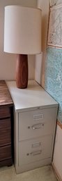 Rm. 8. Two Drawer Metal File Cabinet And Table Top Lamp.
