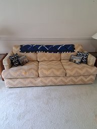 Rm.5. Hide A Bed Couch, Decorative Pillows And Quilt.