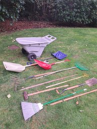 Rm. 00. Plastic Wheelbarrow, Shovels And Garden Tools.