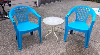 Rm.00. Two Outdoor Plastic Chairs And Outdoor Table.