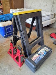Rm. 0. Plastic Portable Saw Horses, Two Four Ton Jackstands, Hydraulic Floor Jack