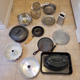 R7 Assorted Cast Iron Pans, Roasting Pan Colanders, Steamer Baskets, Bundt Pans, And Grater