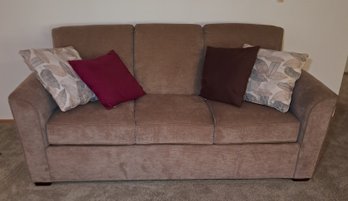 R3 Beige Couch With Four Decorative Pillows