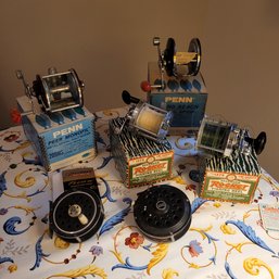 RM4 Collection Of Reels Including Penn, Pflueger Spincaster, 2 Pflueger Rockets #1375 Omni XL 100 And Others