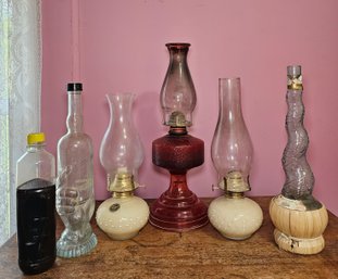 R7 - Assorted Vintage Oil Lamps With Lamp Oil And Glass Bottles