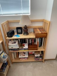 Bookcase, Books, Electric Pencil Sharpener,and  Decorative Boxes