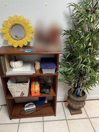 Wooden Bookcase, Artificial Plant, Sunflower Shaped Mirror, Glass Vase, Storage Bins, Alarm Clock Raido.