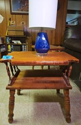 R4 One Wooden Two-tiered End Table With Small Blue Lamp