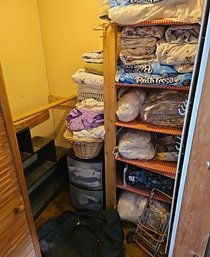 R9 All Contents In Small Closet To Include Full/Queen And Twin Size Sheets, Small Luggage Cart, And Shelf