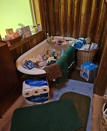 R8 Bathroom Lot To Include Variety Of Towels, Wicker Basket, Humidifier, Spa Supplies, Toilet Paper And More