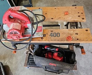 R0 Black And Decker Work Table, Milwaukee Panel Saw, And Skil Router With Bag