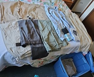 R9 Rubbermaid Container Filled With Men's Shorts And Pants