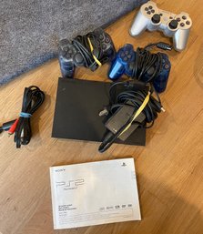 Sony Playstation 2 With Two Controllers And One Additional Wireless Controller, Powercord And HDMI Cord