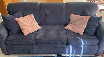 Blue Couch Bed With Blue And Pink Pillows