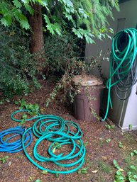 R0 Roll Of Wire, Assorted Hoses, Assorted Yard Stepping Stones, Large Trash Can, Wooden Trellis, Plastic Pots