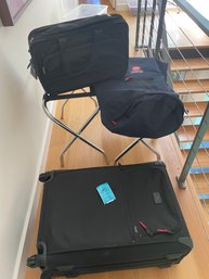 Three Pieces Of Luggage Including A Suitcase, Small Bag And Duffle Like Bag And Two Luggage Stands
