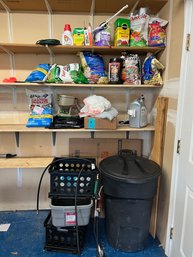 Bags Of  Fertilizer And Plant Food.  Rubbermaid Wheeled Trash Can, Scotts Spreader, Fireplace Lava Rock