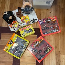 Harley Davidson Collectors Items Including New In Box Toy Motorcycles, Big Rigs, Stuffed Animals And A Case