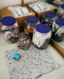 Rm5 Plarn Materials To Include Organized Plastic Bags, Buttons, A Plarn Project Example