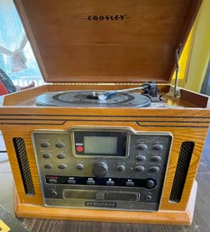 Crosley Record, CD,and Cassette Player As Well As A Collection Of Records From Different Themes And Artists