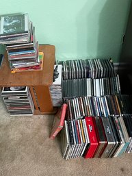 Collection Of CDs With A CD Stand