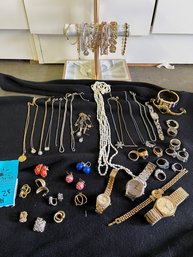 Rm1.  Assortment Of Costume Jewelry.  Rings, Necklaces, Earrings, Watches.  Includes Jewelry Stand
